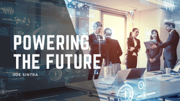 People working on devices in a board room setting with an overlaid text reading "Powering the Future - Joe Sintra" 